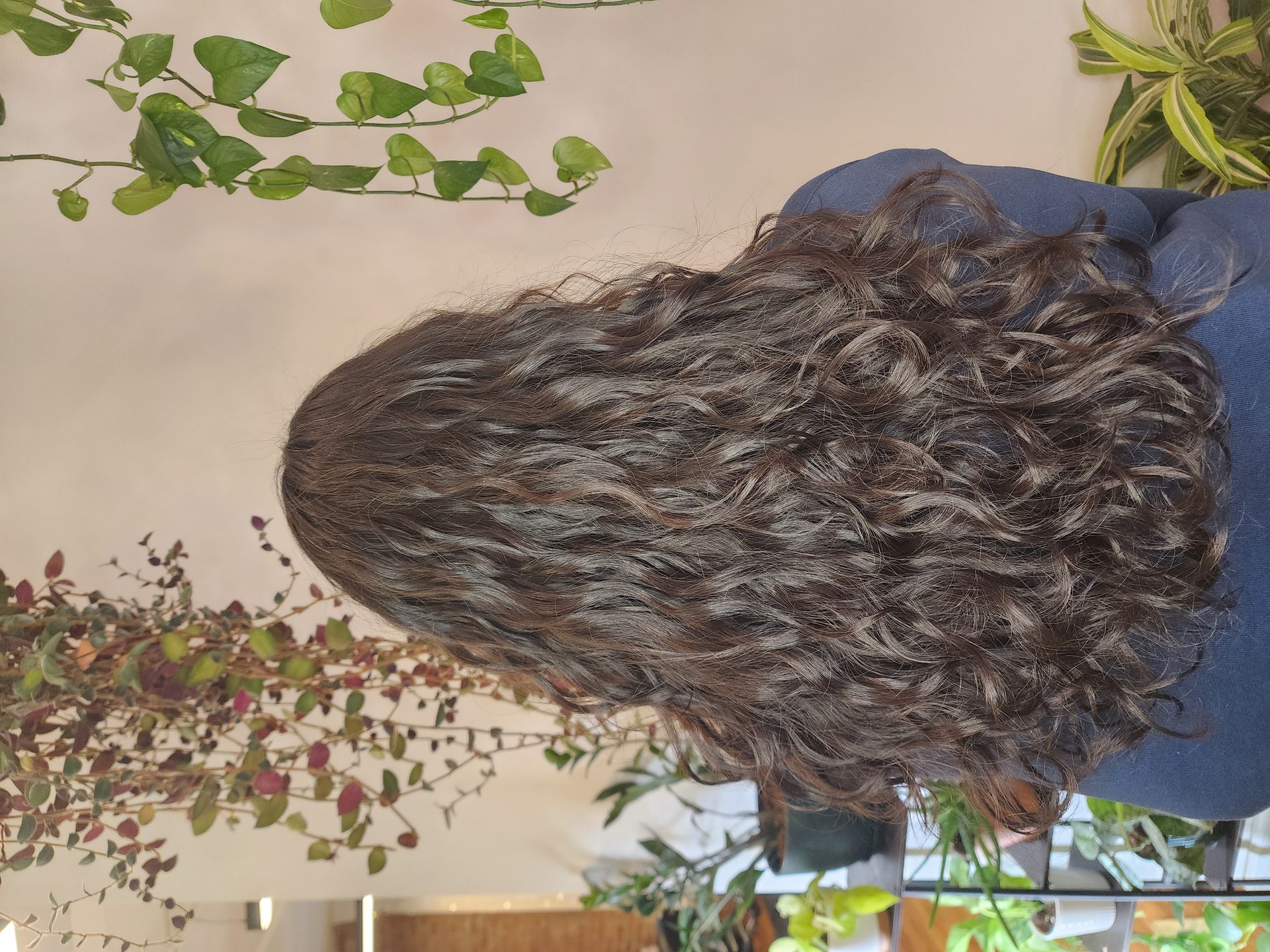 Stylist applying digital perm treatment at Cherishair