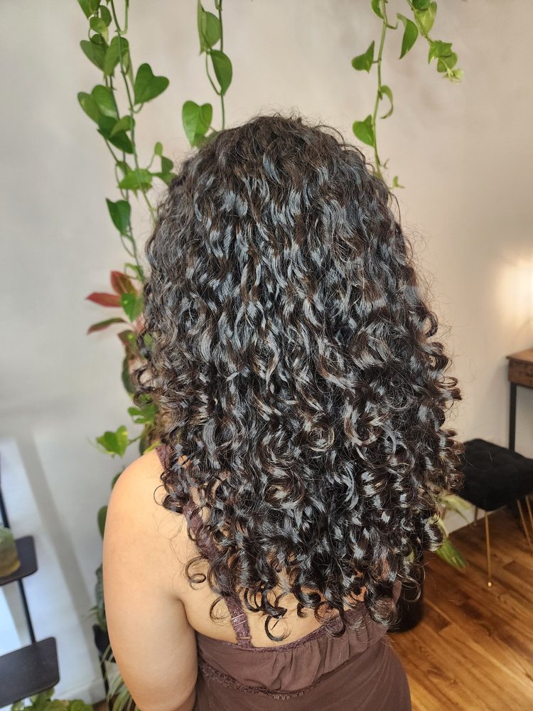 Long dark curly perm result